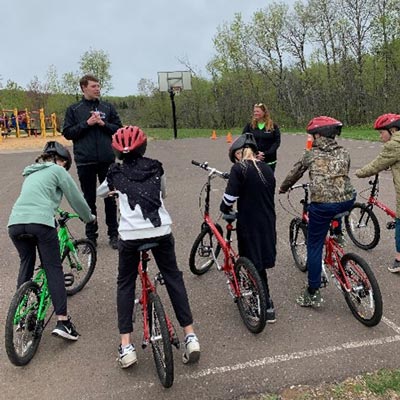 kids listening to bike education outside