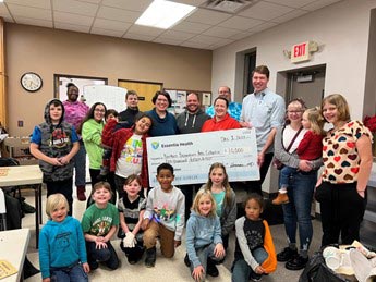 group standing indoors for group photo