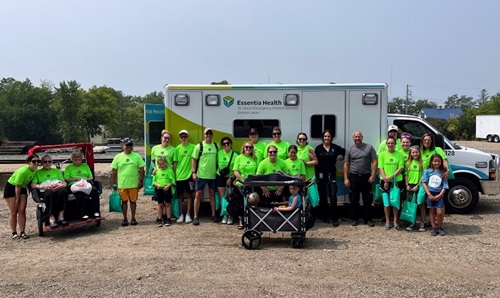 Group in front of ambulance for a parade
