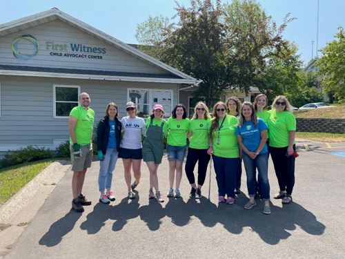group standing in front of First Witness Child Advocacy Center