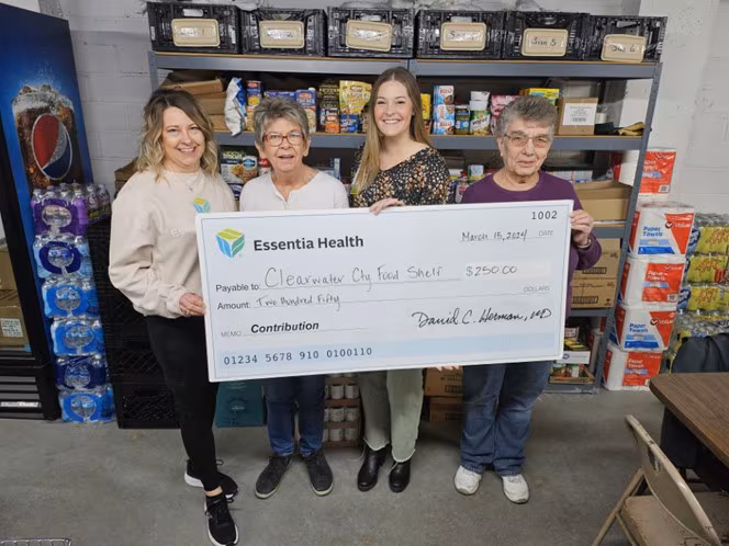 people holding big check