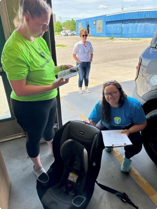 essentia employees with a car seat