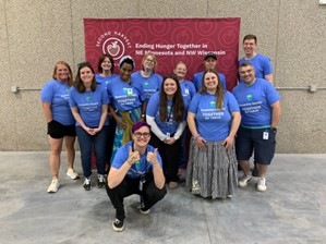 Essentia volunteers in blue T-shirts