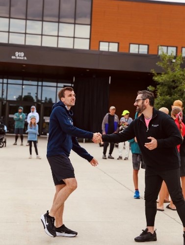 two men exchanging a handshake