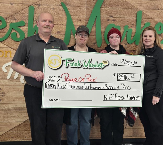 a group of 4 holding a big check
