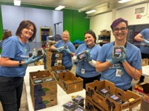 Essentia volunteers with packed items.