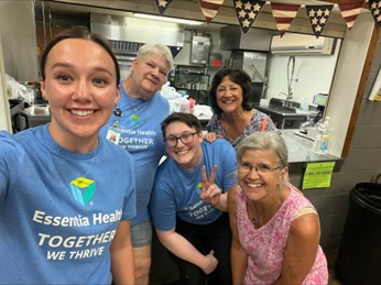 Essentia volunters with smile on their faces